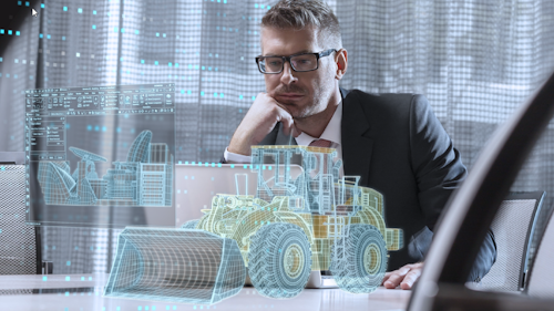 Man working with digitized heavy equipment design tool software
